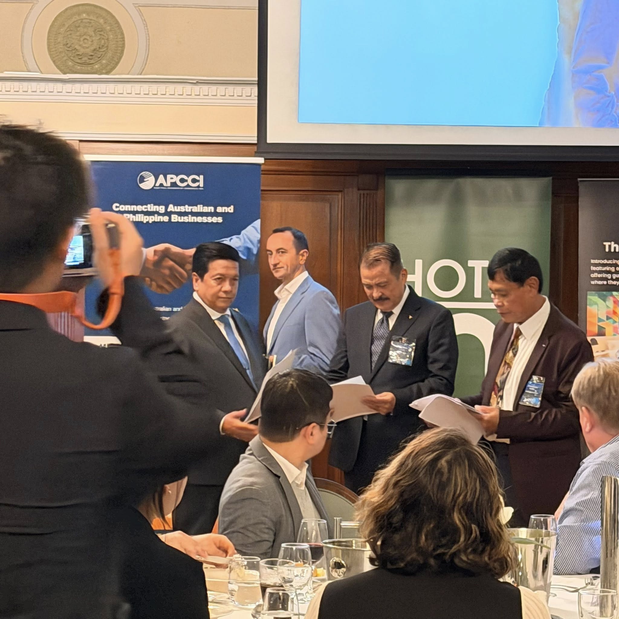 Aust-Phil Trade and Tourism Review and APCCI Officers Induction Night — 29 May 2026 (Officers on stage with APCCI banner)