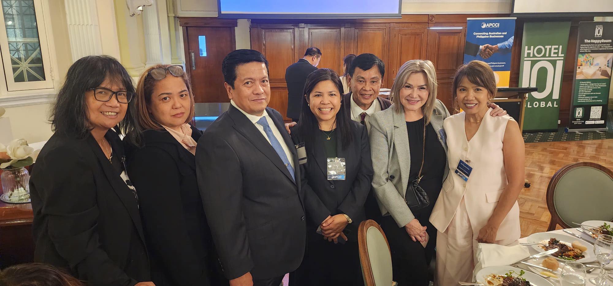 Aust-Phil Trade and Tourism Review and APCCI Officers Induction Night — 29 May 2026 (Dinner table with APCCI and Hotel 101 banners)